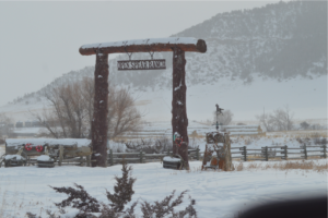 Open Spear Ranch Sign in Snow